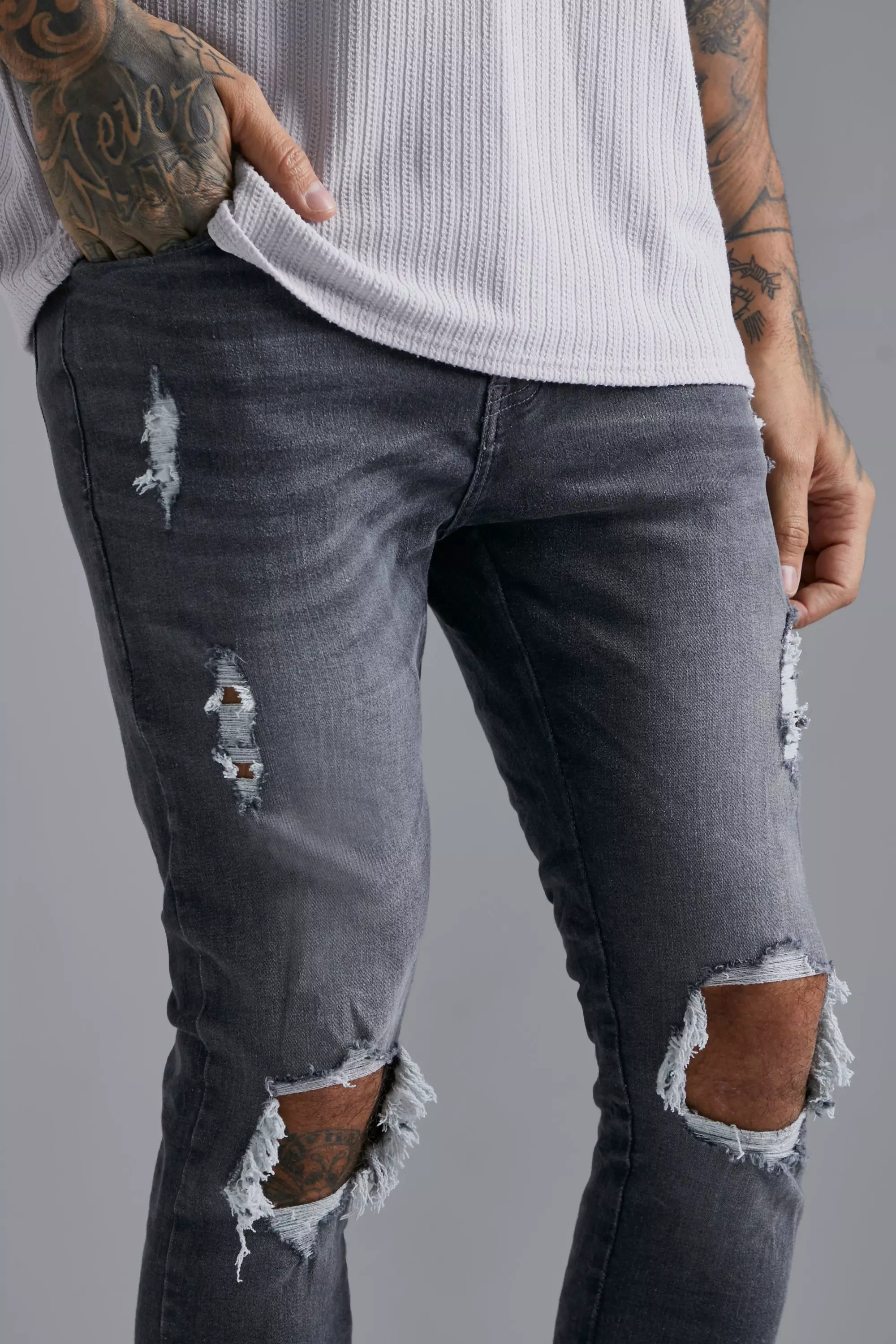 Grey knee hot sale ripped jeans